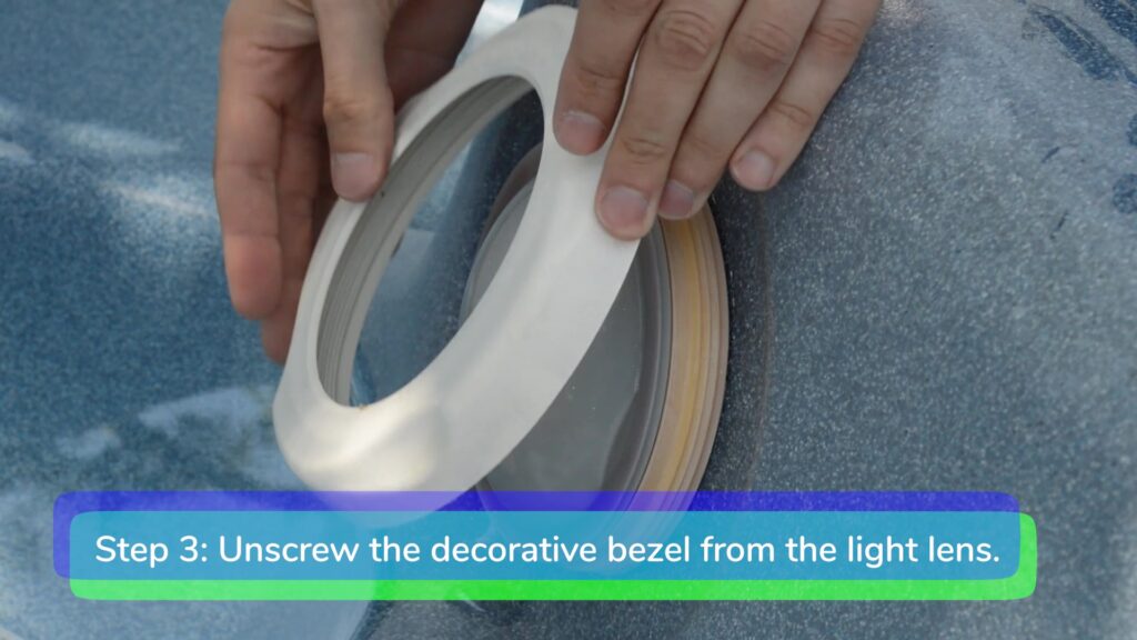 Step 3. Unscrew the decorative bezel-